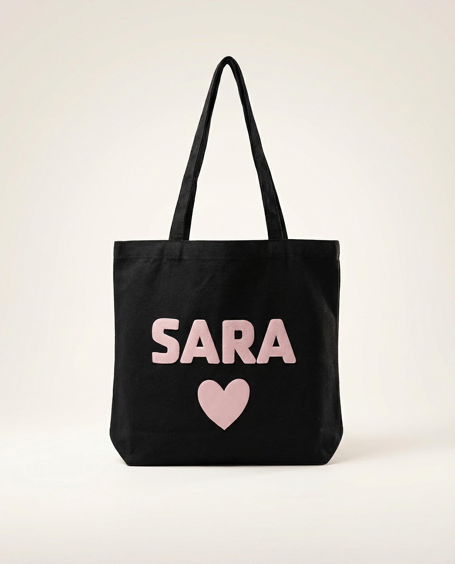 Personalized black cotton tote bag with puff vinyl name in UAE
