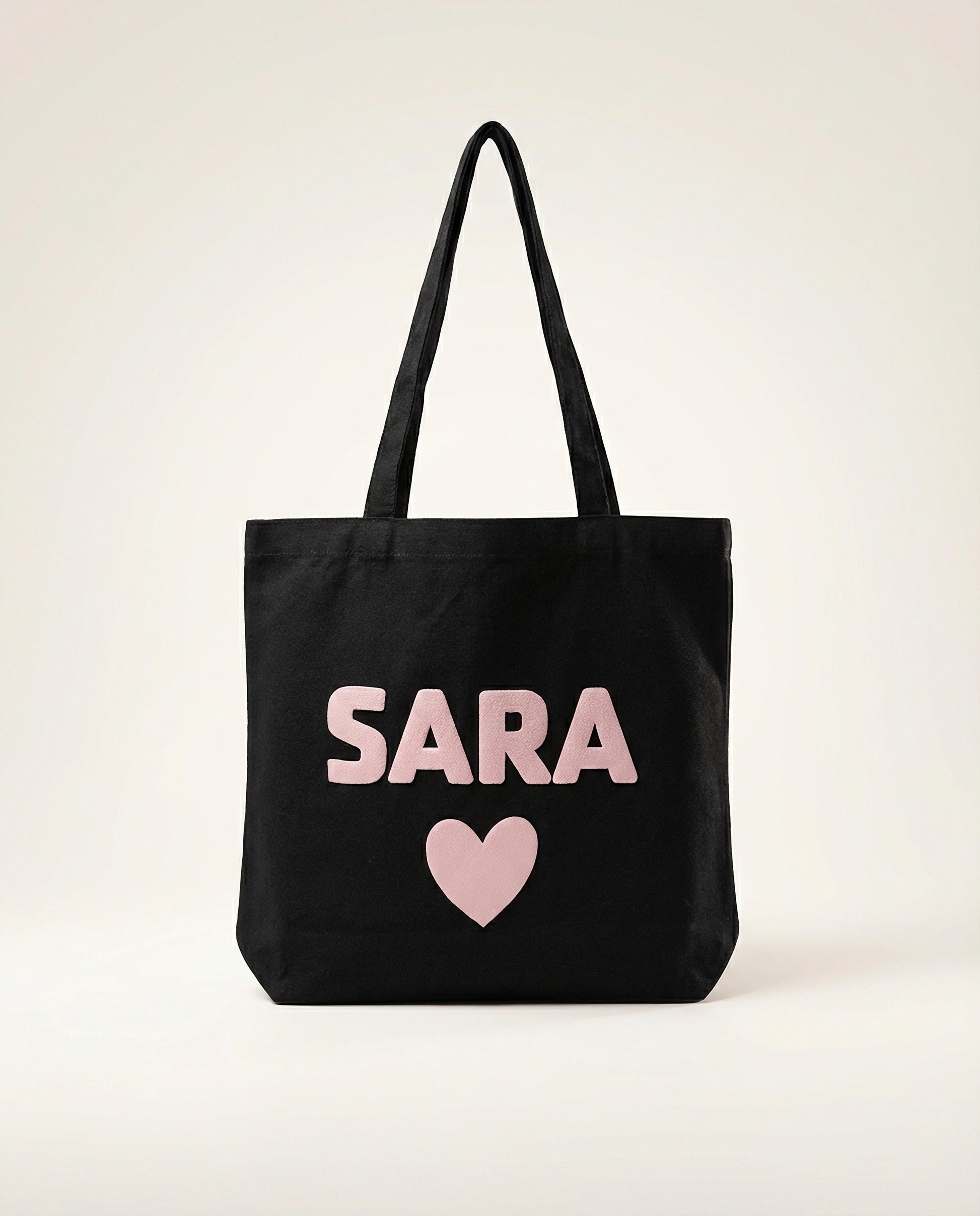 Personalized black cotton tote bag with puff vinyl name in UAE
