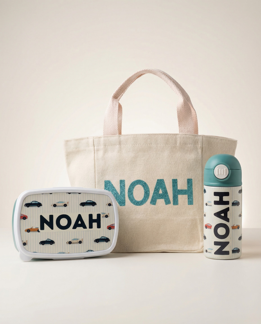 Personalized kids birthday gift set in blue including tote bag, stainless steel water bottle and BPA-free lunch box with custom name print – UAE